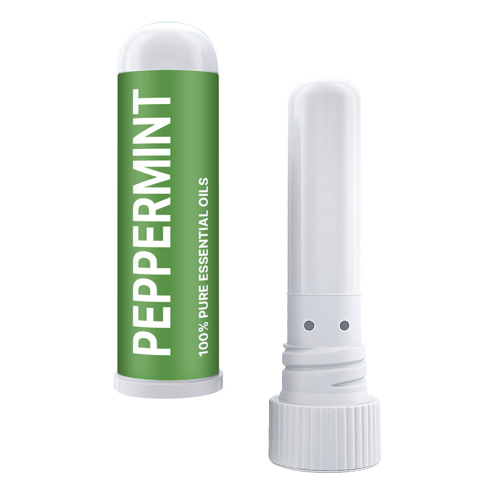 The Nasal Inhaler Sticks For Sniffing To Boost Energy And Sharpen The Mind, with a green PEPPERMINT 100% PURE ESSENTIAL OILS label and an opened white cap, help clear nasal passages for easy breathing.