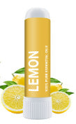 A yellow Nasal Inhaler Stick For Sniffing To Boost Energy And Sharpen The Mind labeled LEMON stands upright, with sliced lemons and green leaves in the background. The label says it contains pure essential oils and boosts energy.