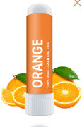 A Nasal Inhaler Stick For Sniffing To Boost Energy And Sharpen The Mind is displayed in front of sliced and whole oranges with green leaves, highlighting its invigorating citrus scent.