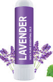 The Nasal Inhaler Sticks For Sniffing To Boost Energy And Sharpen The Mind, featuring a purple label and lavender scent, are surrounded by lavender flowers and help clear nasal passages for soothing aromatherapy on the go.